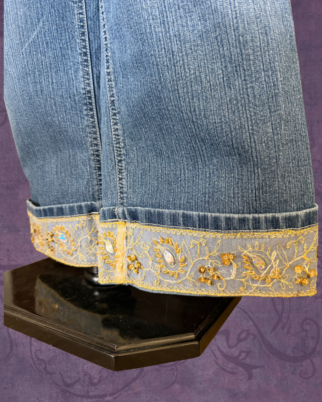 Folded sequined jeans